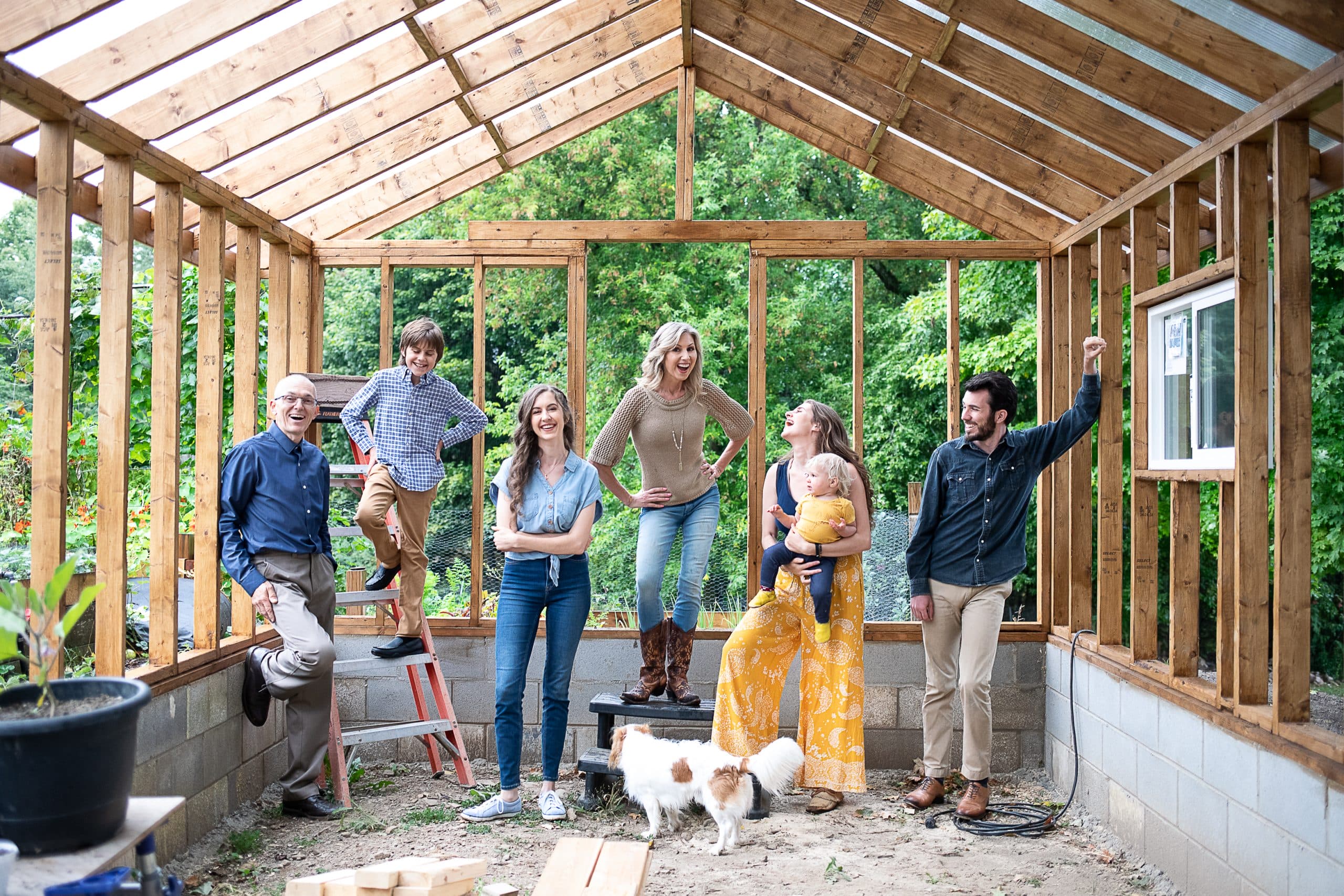 Milousis Family photo in the framing of reno project (house framing)